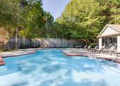 Thumbnail 24 of 49 - a swimming pool with chairs and a house in the background  at Peaks at Gainesville, Gainesville, 30507