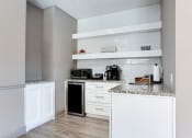 Thumbnail 15 of 49 - a kitchen with white cabinets and counter tops and a sink  at Peaks at Gainesville, Gainesville, GA