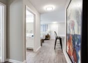 Thumbnail 42 of 49 - a hallway with a view of a living room and a dining room  at Peaks at Gainesville, Gainesville, GA