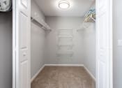 Thumbnail 47 of 49 - an empty closet with shelves and a wall clock  at Peaks at Gainesville, Gainesville, 30507