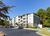 Thumbnail 2 of 49 - an apartment building on a street with cars parked in front of it  at Peaks at Gainesville, Gainesville, 30507
