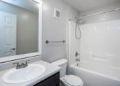 Thumbnail 21 of 27 - an empty bathroom with a sink toilet and shower