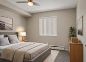 Thumbnail 10 of 22 - A bedroom with a large bed and a ceiling fan.