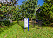 Thumbnail 16 of 20 - a sign in front of a yard with trees and a building in the background at Summit East Ridge, East Ridge, TN 37412