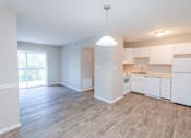Thumbnail 8 of 20 - an empty kitchen and living room in an apartment at Summit East Ridge, Tennessee