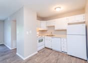 Thumbnail 9 of 20 - a kitchen with white appliances and white cabinets at Summit East Ridge, East Ridge, TN