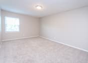Thumbnail 11 of 20 - a bedroom with a white carpet and a window at Summit East Ridge, Tennessee