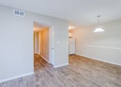 Thumbnail 10 of 20 - a bedroom with hardwood flooring and white walls at Summit East Ridge, East Ridge