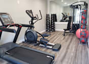 Thumbnail 13 of 20 - a gym with cardio equipment and weights at Summit East Ridge, Tennessee, 37412