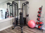 Thumbnail 14 of 20 - a home gym with treadmills and exercise balls at Summit East Ridge, East Ridge, TN 37412