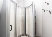 Thumbnail 13 of 14 - a bathroom with a shower stall with a metal gate