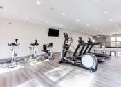 Thumbnail 13 of 46 - Cardio Equipment at The Carter 4250 Apartments, Georgia 30093