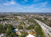 Thumbnail 8 of 31 - a aerial view of a neighborhood of houses and a highway