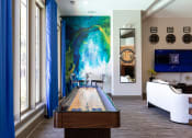 Thumbnail 22 of 29 - Game Room With Shuffle Board at The Metro Apartments, Atlanta