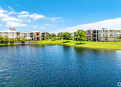 Thumbnail 29 of 34 - a body of water with houses on the other side of it at Ventura at Turtle Creek, Rockledge, Florida