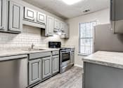 Thumbnail 18 of 60 - Kitchen at Wildcreek Apartments, Clarkston, GA 30021
