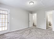 Thumbnail 37 of 60 - Carpeted Living Area at Wildcreek Apartments, Georgia 30021