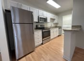 Thumbnail 17 of 31 - Renovated kitchen at Oasis at Twinwood in Wilmington, NC