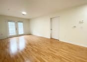 Thumbnail 24 of 31 - Living room with beautiful hardwood floors at Oasis at Twinwood in Wilmington, NC