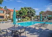 Thumbnail 9 of 18 - our apartments have a swimming pool with tables and chairs