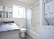 Thumbnail 21 of 26 - a bathroom with a sink toilet and a shower