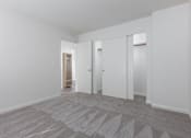 Thumbnail 22 of 26 - a living room with white walls and white doors