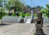 Thumbnail 9 of 39 - Lounge area for residents, fitted with a paved walkway, stairway, and statues at Park Lane Villa.