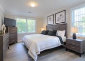 Thumbnail 13 of 15 - a bedroom with a bed and two dressers