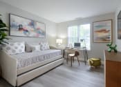 Thumbnail 6 of 8 - a bedroom with a bed and a desk with a computer