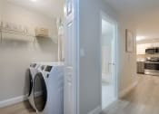 Thumbnail 8 of 8 - a washer and dryer in a laundry room