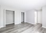 Thumbnail 24 of 30 - A room with a grey floor and white walls.