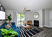 Thumbnail 5 of 22 - Open living room with large window and hardwood floors at 15Seventy, Chesterfield, MO 63017