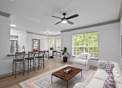 Thumbnail 4 of 30 - a living room with a white couch and a table with chairs at The Aster Sugar Land, Texas