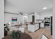 Thumbnail 5 of 30 - white living room and kitchen with island and dining room table and couch at The Aster Sugar Land, Texas