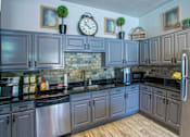 Thumbnail 21 of 30 - Upscale Stainless Steel Appliances at The Aster Sugar Land Apartments, Sugar Land, Texas