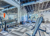 Thumbnail 23 of 38 - a gym with weights and cardio equipment at The Beck at Hidden River, Florida