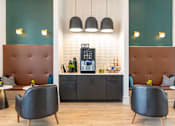 Thumbnail 20 of 43 - A modern cafe with brown booths and black chairs.