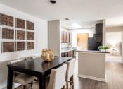 Thumbnail 6 of 40 - Dining Room overlooking Kitchen located at Addison on Cobblestone located in Fayetteville, GA 30215