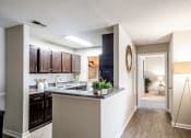 Thumbnail 7 of 40 - Kitchen and hallway to bedroom located at Addison on Cobblestone located in Fayetteville, GA 30215