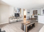 Thumbnail 9 of 40 - Large living room with LVT flooring located at Addison on Cobblestone located in Fayetteville, GA 30215