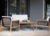 Thumbnail 10 of 22 - Patio with a White Couch at The Addison at Collierville Apartments, Tennessee, 38017