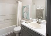 Thumbnail 7 of 22 - Bathroom with a White Toilet at The Addison at Collierville Apartments, Collierville, 38017