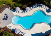 Thumbnail 12 of 25 - Aerial View of Pool and Pool Deck at One Rocky Ridge Apartment, Georgia
