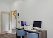 Thumbnail 24 of 42 - Business center with dual computer workstations and printer at Alden Place at South Square Apartments, Durham, NC 27707