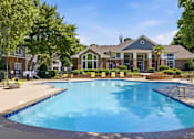 Thumbnail 1 of 42 - Resort style swimming pool with clubhouse and sundeck at Alden Place at South Square Apartments, Durham