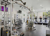 Thumbnail 21 of 42 - Fitness center with cable machines and free weights at Alden Place at South Square Apartments, North Carolina