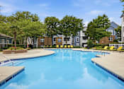 Thumbnail 33 of 42 - Sparkling swimming pool with sundeck and apartment homes at Alden Place at South Square Apartments, Durham, North Carolina