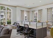 Thumbnail 35 of 42 - Business lounge with work cubicles and seating area at Alden Place at South Square Apartments, North Carolina