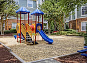 Thumbnail 29 of 42 - Playground with slides and climbing structure at Alden Place at South Square Apartments, Durham, 27707