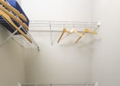 Thumbnail 16 of 40 - a spacious closet with shelves and a basket in the corner at Ansley at Town Center, Evans, Georgia